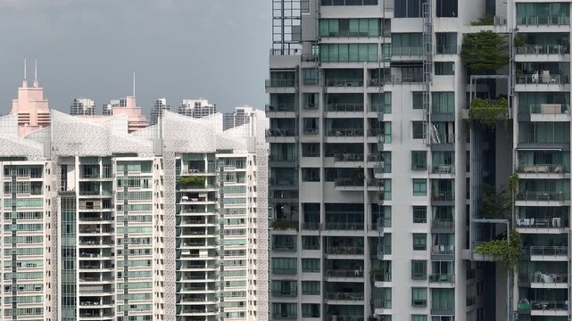 day time singapore city residential modern apartment buildings balcony front exterior aerial panorama 4k 