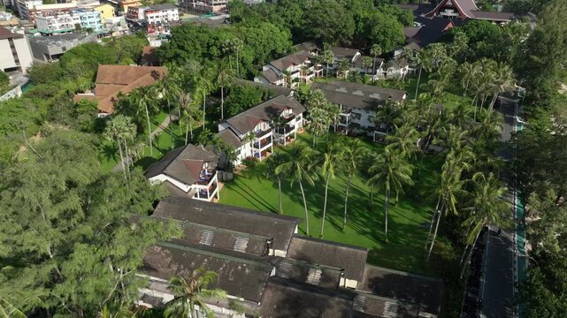 day time phuket island famous modern hotel exterior kata beach bay aerial panorama 4k thailand
