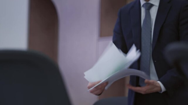 Professional businessman handing over important documents with motion blur, emphasizing efficiency and urgency in a corporate setting. Dynamic transfer of paperwork.