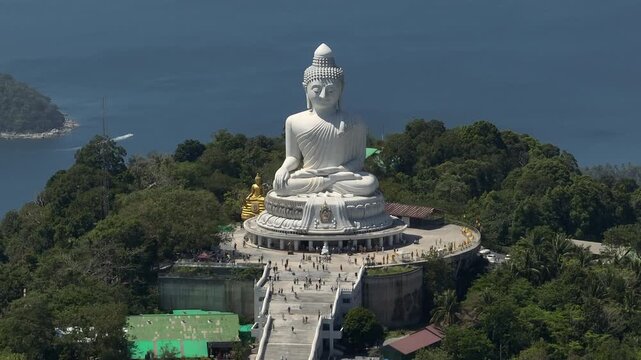 sunny day phuket island famous crowded park mountain top big buddha monument front bay aerial panorama 4k thailand