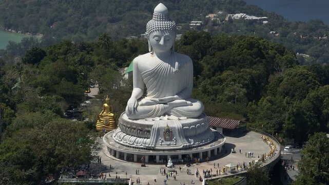 sunny day phuket island famous crowded park mountain top big buddha monument front aerial panorama 4k thailand