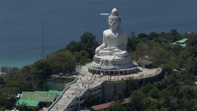 sunny day phuket island famous crowded park mountain top big buddha monument coastline aerial panorama 4k thailand