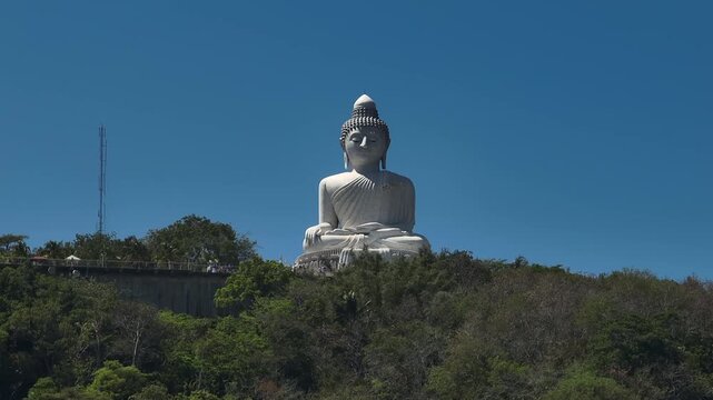 day time phuket island famous mountain park top big buddha monument front aerial panorama 4k thailand