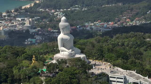 sunny day phuket island famous mountain top crowded square big buddha monument karon town view aerial panorama 4k thailand
