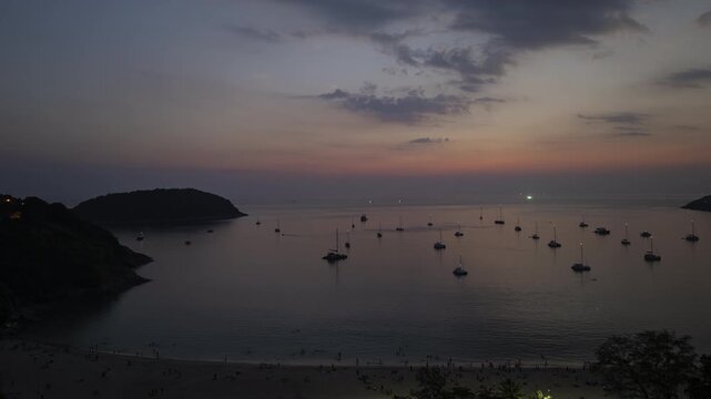 sunset time phuket island famous crowded beach bay dock aerial panorama 4k timelapse thailand