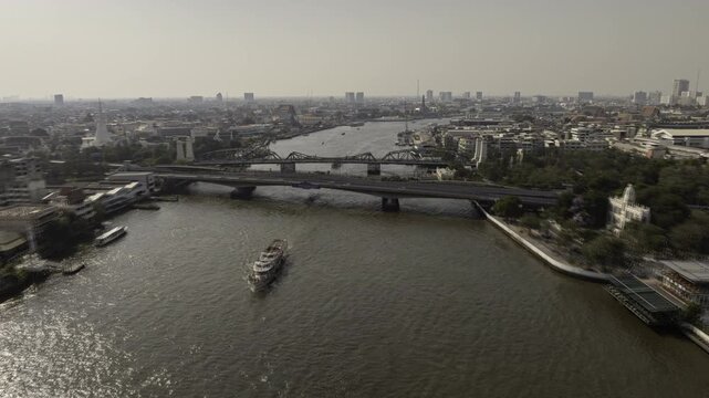 sunny day flight over bangkok city center traffic river bridge aerial panorama 4k timelapse thailand