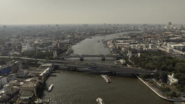 sunny day flight over bangkok city center traffic river aerial panorama 4k timelapse thailand