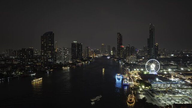 night time illumination bangkok city traffic river famous ferris wheel bay park aerial panorama 4k timelapse thailand