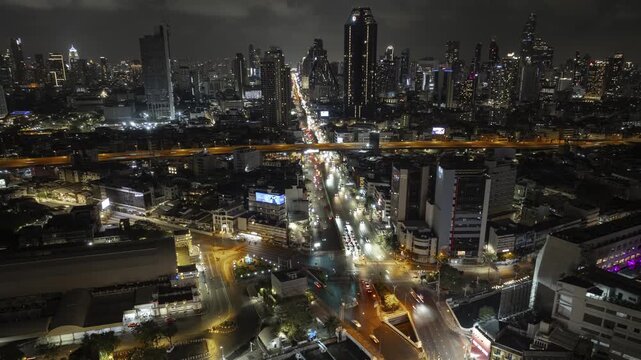 night time illumination bangkok city train station traffic street square aerial panorama 4k timelapse thailand  