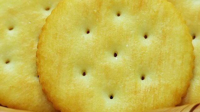 Golden round cracker isolated  crispy baked snack for appetizers and healthy eating 