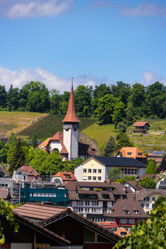 Spiez church and village nestled among vineyards in Switzerland