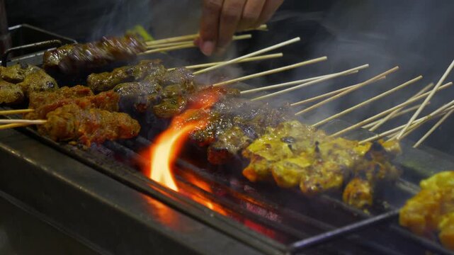 penang island george town city famous street food grilled meat close up slow motion panorama 4k malaysia