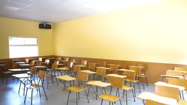 Video of an empty educational classroom showcasing study desks, school furniture, and organized learning space in an academic institution.