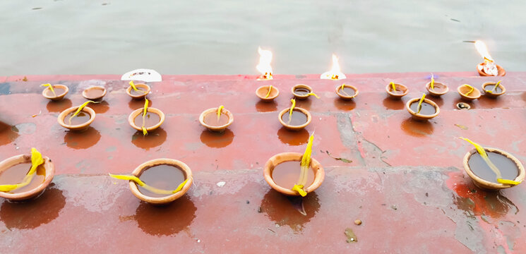 Clay Oil Lamps (Diyas) on Ghat Steps Near Yamuna River