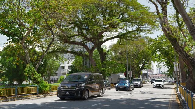 sunny day penang island george town city center traffic street slow motion panorama 4k malaysia