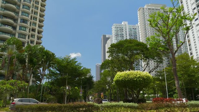 sunny day penang island george town modern apartment buildings area slow motion park traffic panorama 4k malaysia