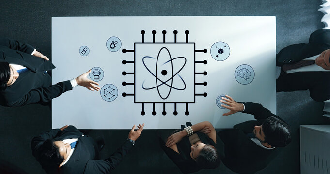 A diverse business team engages in a technology discussion, surrounded by scientific icons on a modern office table, symbolizing innovation and collaboration. Trope