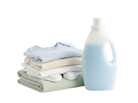 Stack of baby clothes with a bottle of laundry detergent isolated on transparent background
