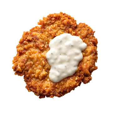 Crispy golden chicken fried steak topped with creamy country gravy, featuring a crunchy crust and classic Southern comfort food appeal.