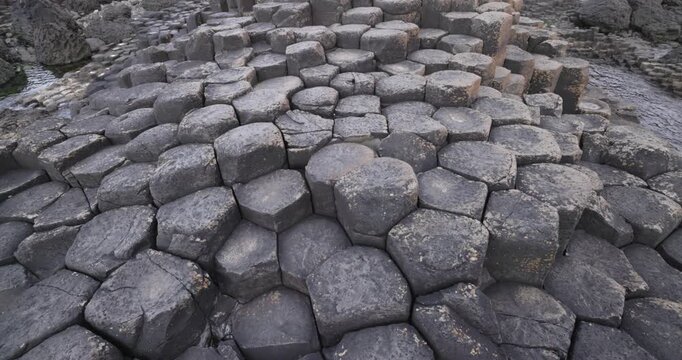 overhead shot of the naturally formed basalt rocks at the Giants Causeway