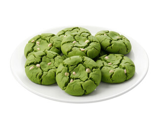 Obraz premium A plate of green cookies with white seeds on a white plate isolated on transparent background