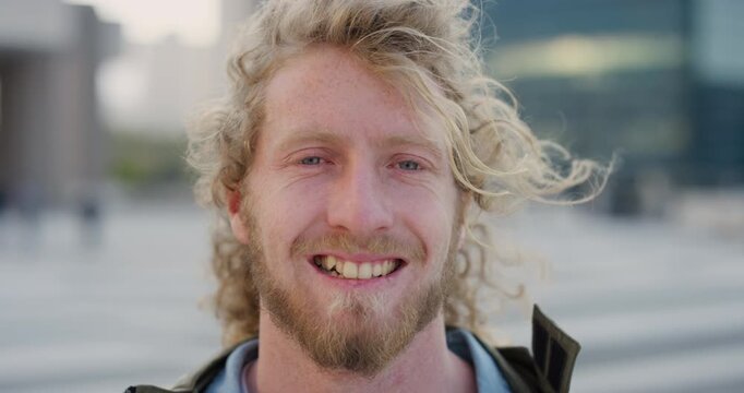 Face, smile and man in city for travel, career and job opportunity outdoor with confidence. Portrait, happy professional and coordinator in town with wind for commute, about us and event management