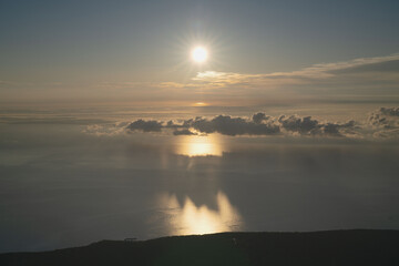 Fototapeta premium Hokkaido, sea of clouds and mountain peak, with morning glow, in september, scenery