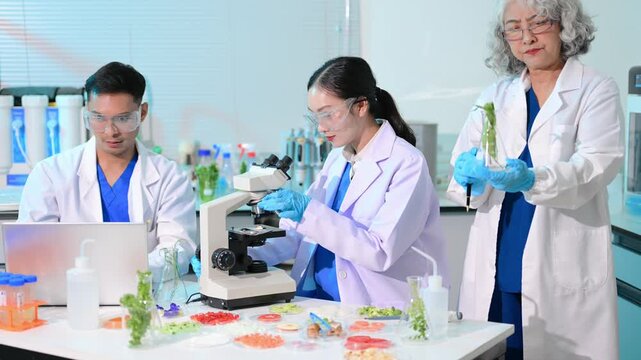 Team nutritionist in lab coat analyzing food and writing in notebook. Healthy eating, organic testing, and nutrition science in a clean lab.