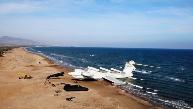 Heavy Equipment Clears And Recovers Shoreline. Excavators And Barriers Assist In Beach Cleanup. Media