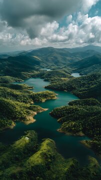 Stunning aerial perspective of winding lakes amidst lush green mountains