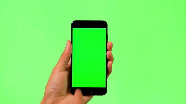 A person using an I phone and touch with finger green screen video in 4K