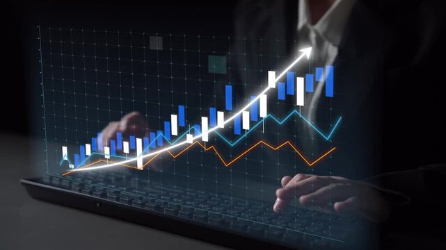 A close-up view of hands typing on a laptop keyboard while interacting with a digital graph representing stock market trends, illustrating financial insights and data analysis. Copula
