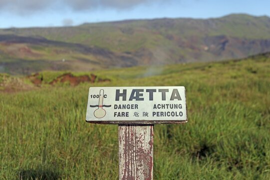Sign warning of hot springs and heat in a geothermal field, Reykjadalur, Hveragerdi, Iceland