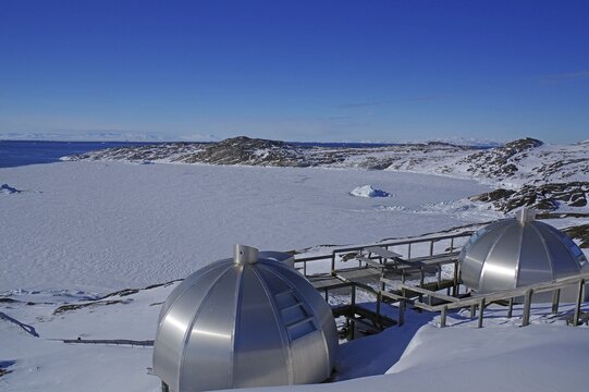 Futuristic metal igloo shelters in a wintry landscape, tourism, Ilulissat, Disko Bay, Arctic, Greenland, Denmark, North America