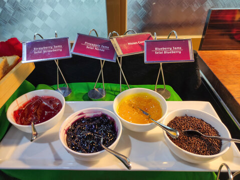 Breakfast Buffet Station with Fruit Jams and Chocolate Sprinkles