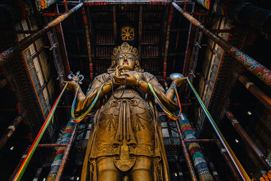 Interior of Gandantegchinlen Monastery featuring the giant Avalokiteshvara statue (Buddha statue) in Ulaanbaatar, Mongolia.
