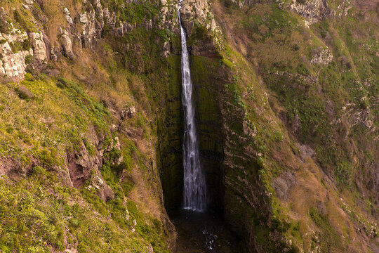 Miradouro da Garganta Funda waterfall, Ponta do Pargo Madeira Portugal, plunging into a deep volcanic gorge near the Atlantic coast.