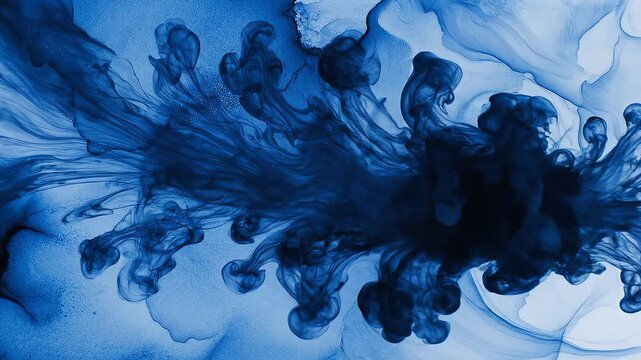 Abstract blue liquid ink swirling and flowing in water background swirl flow cloud dye artistic