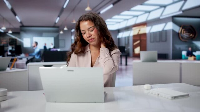 Woman Sitting In Office Chair With Bad Posture Feeling Neck