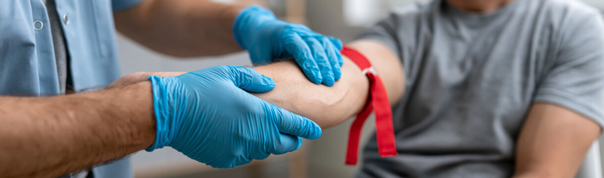 Medical Draw: A medical professional in blue gloves applies a tourniquet to a patient's arm, preparing for a blood draw. The close-up shot highlights the sterile procedure and the patient's readiness.
