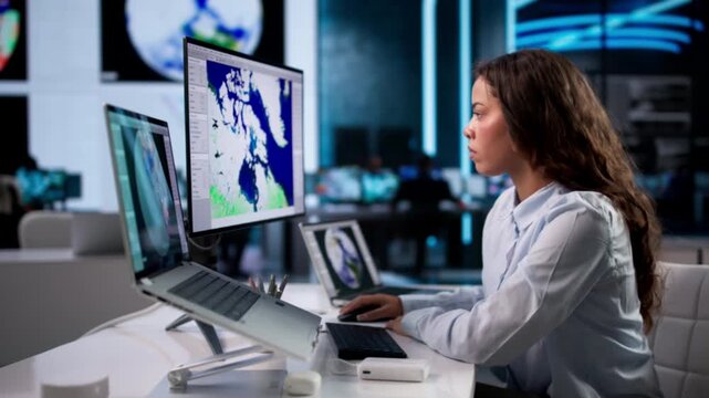 Meteorologist Studies Weather Data On Laptop