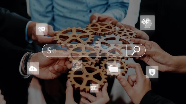 A diverse team collaborates by joining hands over interlocking gears, symbolizing unity and shared goals in technology and innovative problem-solving. Raster