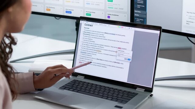 Editor Carefully Reviews And Corrects A Woman&rsquo;s Laptop Text