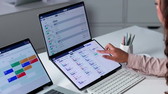 Human Resources Manager Reviewing Applicant Tracking System