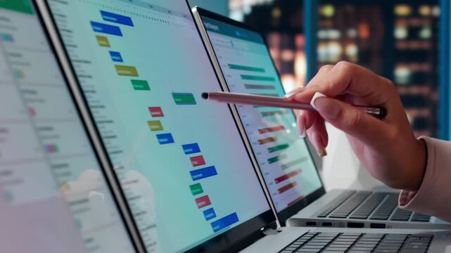 Agile Project Manager Carefully Updates Tasks On Scrum Board