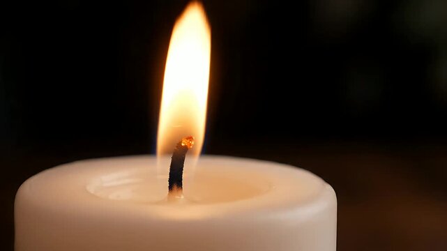 Macro Close Up of Candle Flame Burning in Dark Space