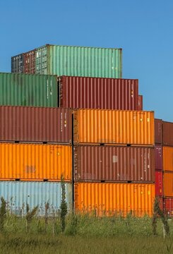 View of stacked colorful shipping containers in a port area under a clear blue sky Avcilar, Istanbul, Turkey.