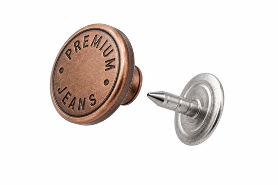 A classic copper jeans button cap and its sharp metal tack pin floating slightly apart in mid air exploded view concept isolated on a pure white