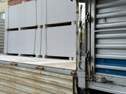 View of stacks of gypsum boards secured with straps on a delivery truck bed Sariyer, Istanbul, Turkiye.
