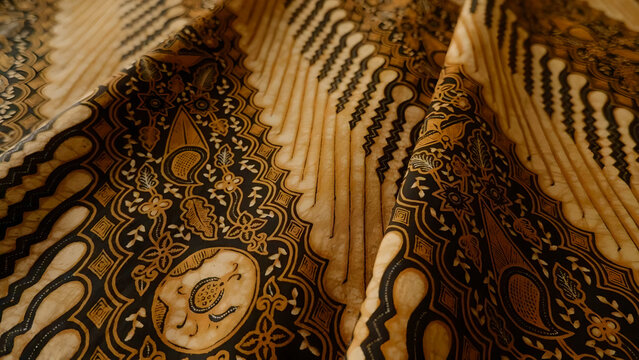 Batik fabric textile in Indonesian traditional style provides elegant pattern for fashion design and cultural art background